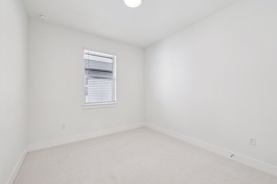 Spacious, unfurnished interior of a new home in Koenig Townhomes, Austin (Image 21).
