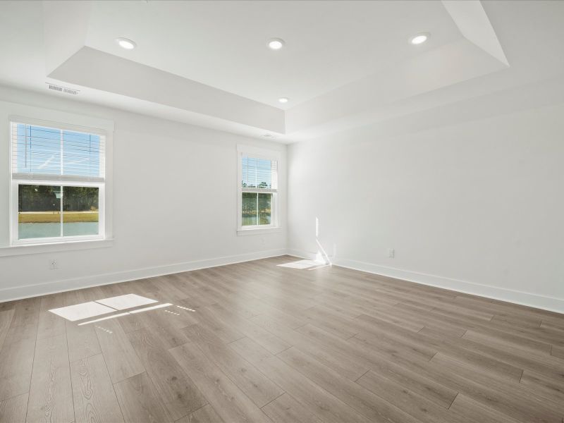 Spacious, unfurnished interior of a new home in The Coves at Lakes of Cane Bay II, Summerville (Image 19).