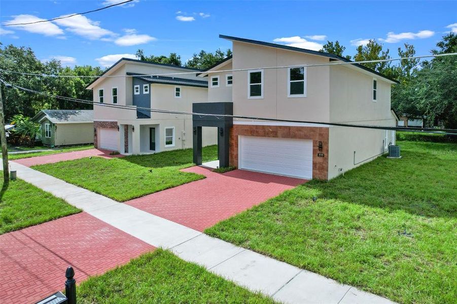 Front exterior of a new home in , Orlando, FL, highlighting curb appeal (Image 29).