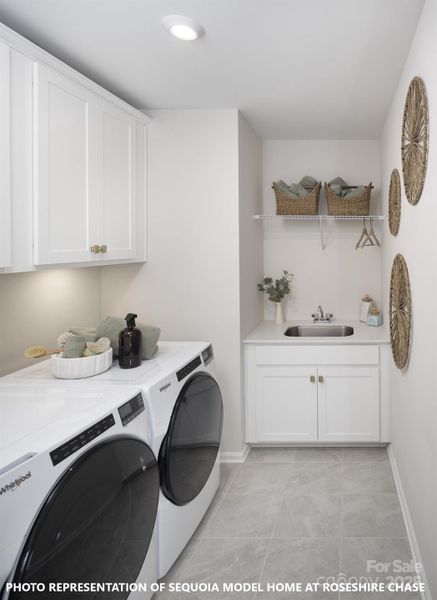 Upper Level Laundry Room with Built-In Cabinets and Sink (Photo representation of the Sequoia Model Home at Roseshire Chase - colors, finishes and options will vary)