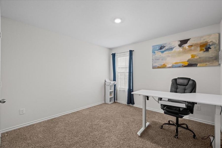 Home office featuring carpet flooring and baseboards Home office featuring carpet flooring and baseboards