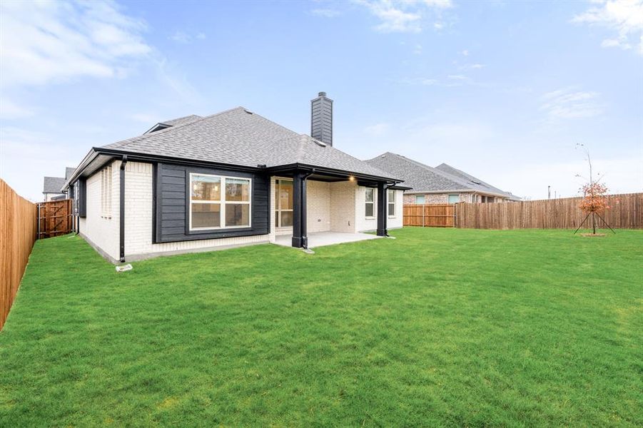 Exterior details and patio area of a home in Villages of Hurricane Creek, Anna (Image 21).