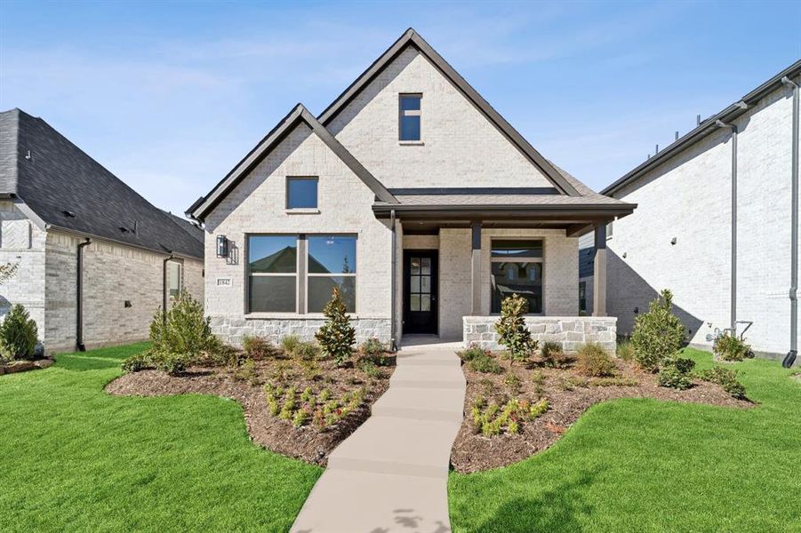 Front exterior of a new home in Mantua Point Gardens, Van Alstyne, TX, highlighting curb appeal (Image 1). Front exterior of a new home in Mantua Point Gardens, Van Alstyne, TX, highlighting curb appeal (Image 1).