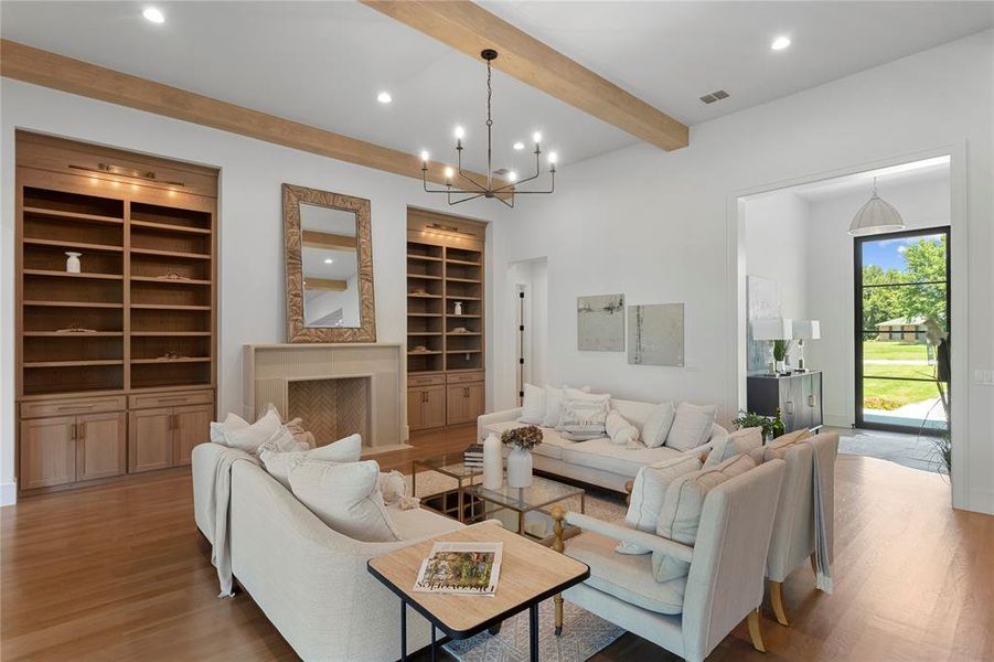 Living room featuring beamed ceiling.