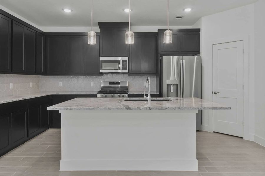 Representative furnished interior of a home built from the Carriagehouse by Chesmar Homes in Meridiana Townhomes, Iowa Colony (Image 56).
