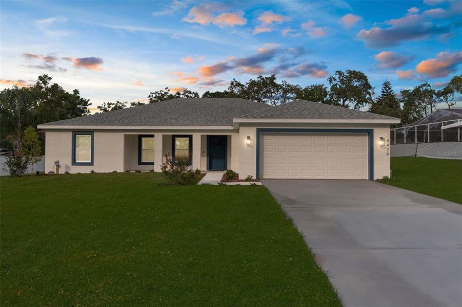 Front exterior of a new home in , Spring Hill, FL, highlighting curb appeal (Image 26).