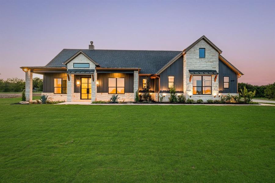 View of front of home with a yard