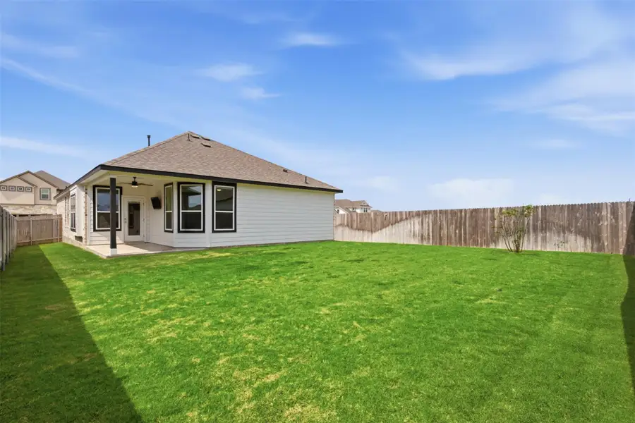 Exterior details and patio area of a home in , Manor (Image 3).