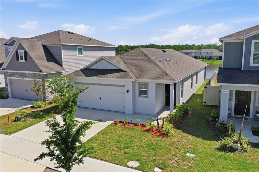 Front exterior of a new home in , St. Cloud, FL, highlighting curb appeal (Image 25).