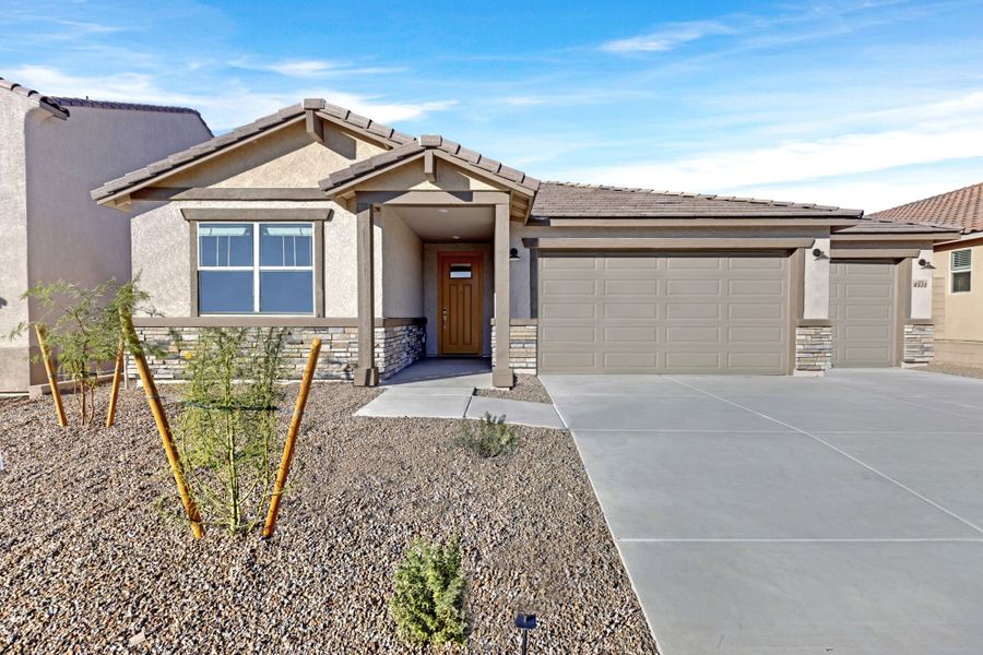 Front exterior of a new home in Montelena, Marana, AZ, highlighting curb appeal (Image 1). Front exterior of a new home in Montelena, Marana, AZ, highlighting curb appeal (Image 1).
