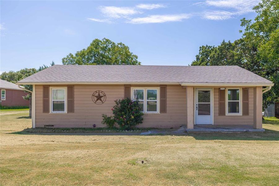 View of front of property featuring a front lawn and roof with shingles View of front of property featuring a front lawn and roof with shingles