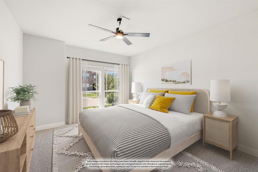 Bedroom with ceiling fan, wood-frame bed, yellow accent pillows, and sliding glass door with natural light Bedroom with ceiling fan, wood-frame bed, yellow accent pillows, and sliding glass door with natural light