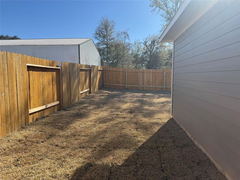 Exterior details and patio area of a home in East Gate Villas, Willis (Image 15).