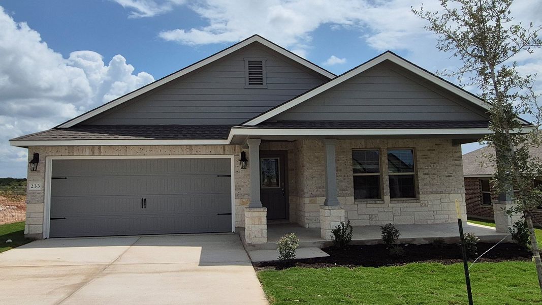 Front exterior of a new home in Creekfall, Burnet, TX, highlighting curb appeal (Image 1). Front exterior of a new home in Creekfall, Burnet, TX, highlighting curb appeal (Image 1).