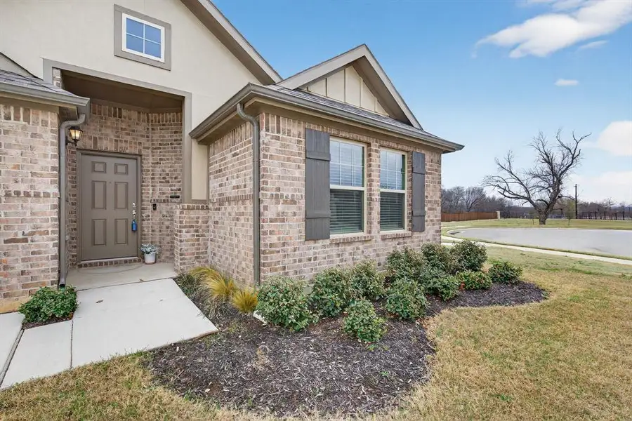 Exterior details and patio area of a home in Sagebrook, Denton (Image 4).