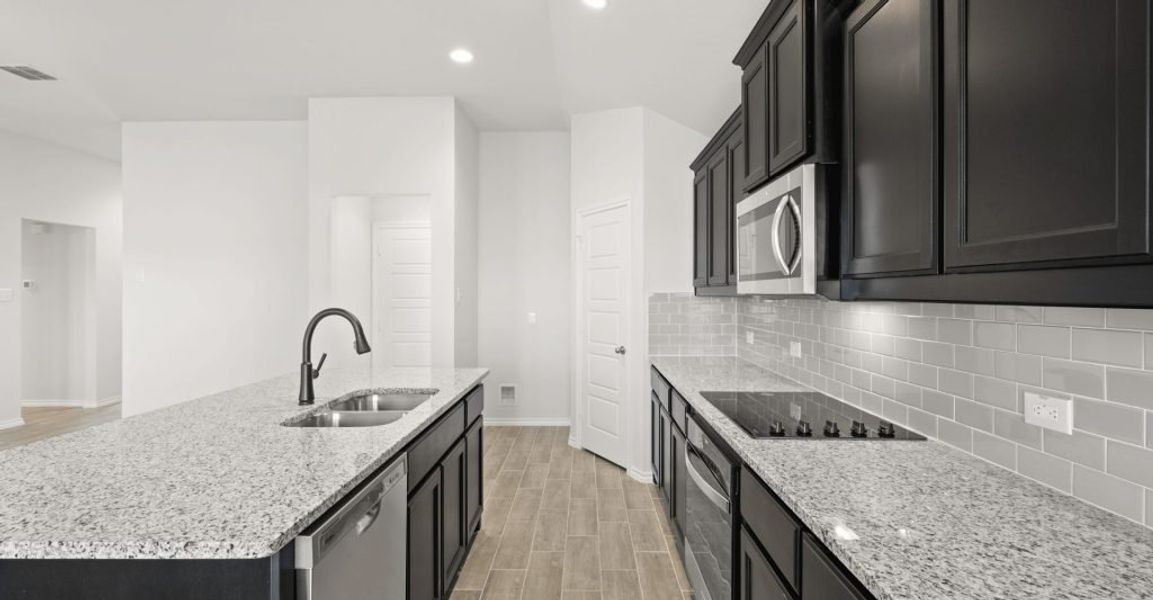 Representative exterior photo of a completed home built from the Pembridge II by Impression Homes in Mountain Valley, Burleson, TX (Image 6). Representative exterior photo of a completed home built from the Pembridge II by Impression Homes in Mountain Valley, Burleson, TX (Image 6).