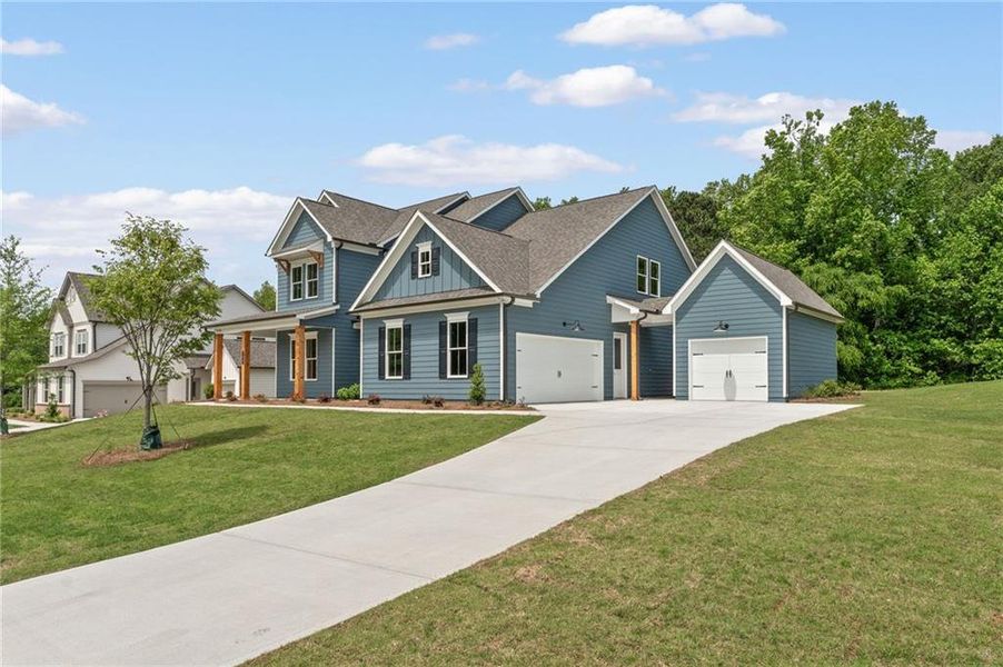Front exterior of a new home in Oak Valley Estates, Marietta, GA, highlighting curb appeal (Image 1). Front exterior of a new home in Oak Valley Estates, Marietta, GA, highlighting curb appeal (Image 1).
