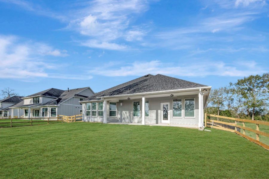Exterior details and patio area of a home in The Oaks on 6th Street, Magnolia (Image 3).