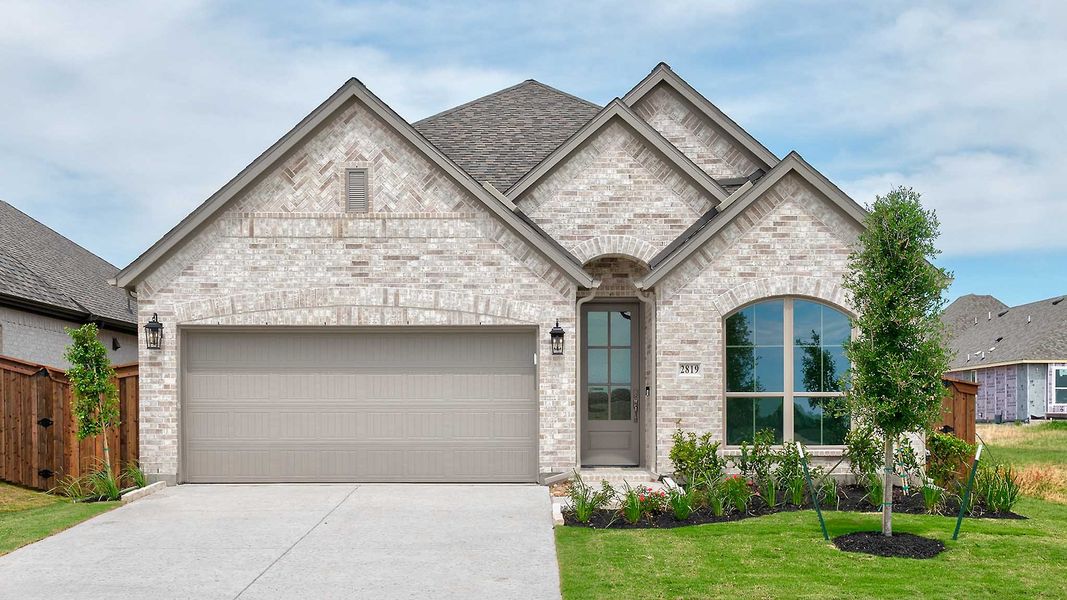 Front exterior of a new home in Meraki, Forney, TX, highlighting curb appeal (Image 1). Front exterior of a new home in Meraki, Forney, TX, highlighting curb appeal (Image 1).