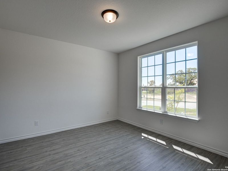 Spacious, unfurnished interior of a new home in The Reserve at Potranco Oaks, Castroville (Image 23).