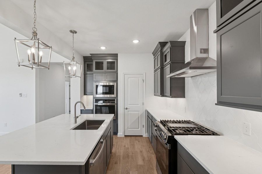 Gorgeous kitchen with grey cabinets and quartz countertops Gorgeous kitchen with grey cabinets and quartz countertops
