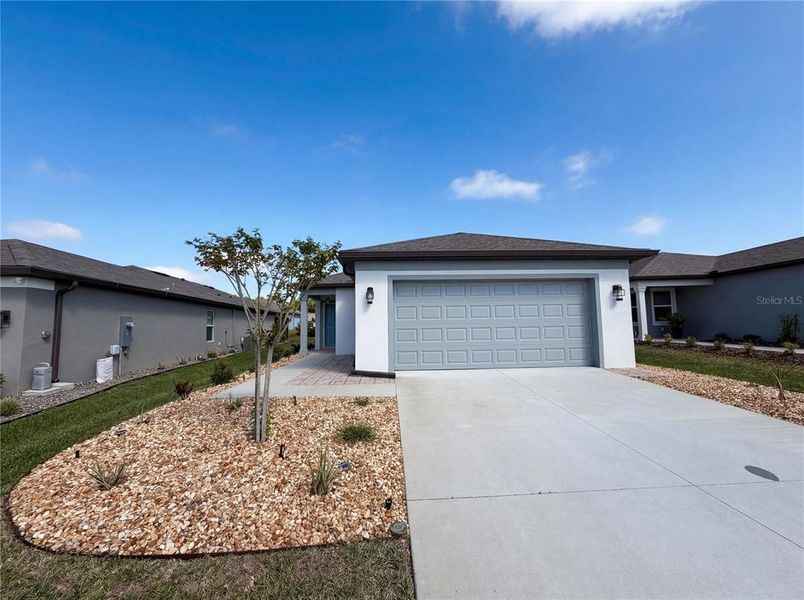 Front exterior of a new home in , Ocala, FL, highlighting curb appeal (Image 21). Front exterior of a new home in , Ocala, FL, highlighting curb appeal (Image 21).