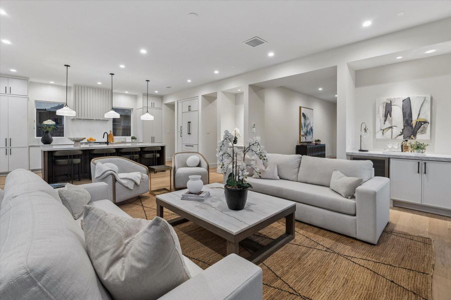 The living room flows seamlessly into the kitchen, creating an ideal space for both entertaining and everyday living.