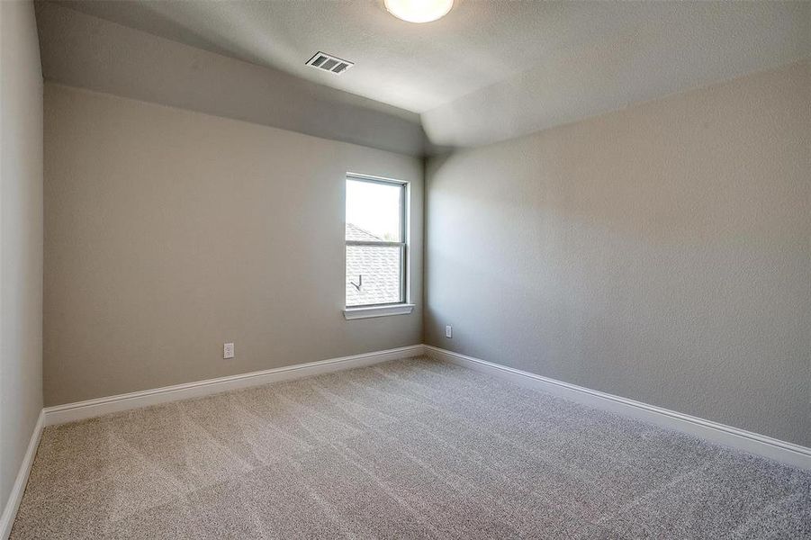 Spare room with carpet flooring