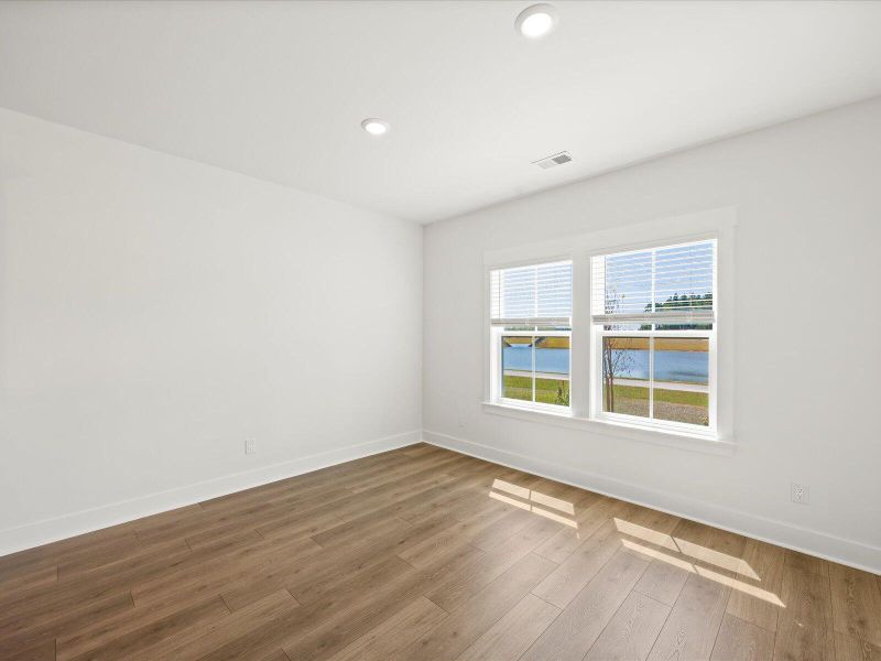Spacious, unfurnished interior of a new home in The Coves at Lakes of Cane Bay II, Summerville (Image 21). Spacious, unfurnished interior of a new home in The Coves at Lakes of Cane Bay II, Summerville (Image 21).