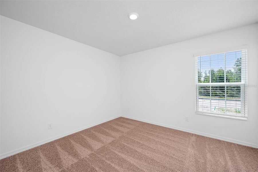 Spacious, unfurnished interior of a new home in Noah Estates at Tuscany Preserve, Poinciana (Image 14).