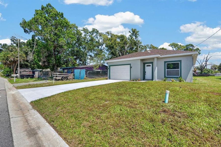 Front exterior of a new home in , Daytona Beach, FL, highlighting curb appeal (Image 19). Front exterior of a new home in , Daytona Beach, FL, highlighting curb appeal (Image 19).