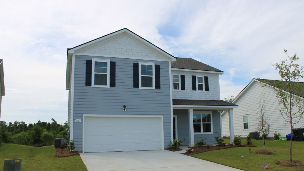 Front exterior of a new home in Kingston Bay, Conway, SC, highlighting curb appeal (Image 2).