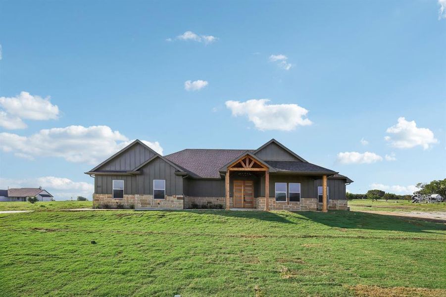 Craftsman-style house with a front lawn