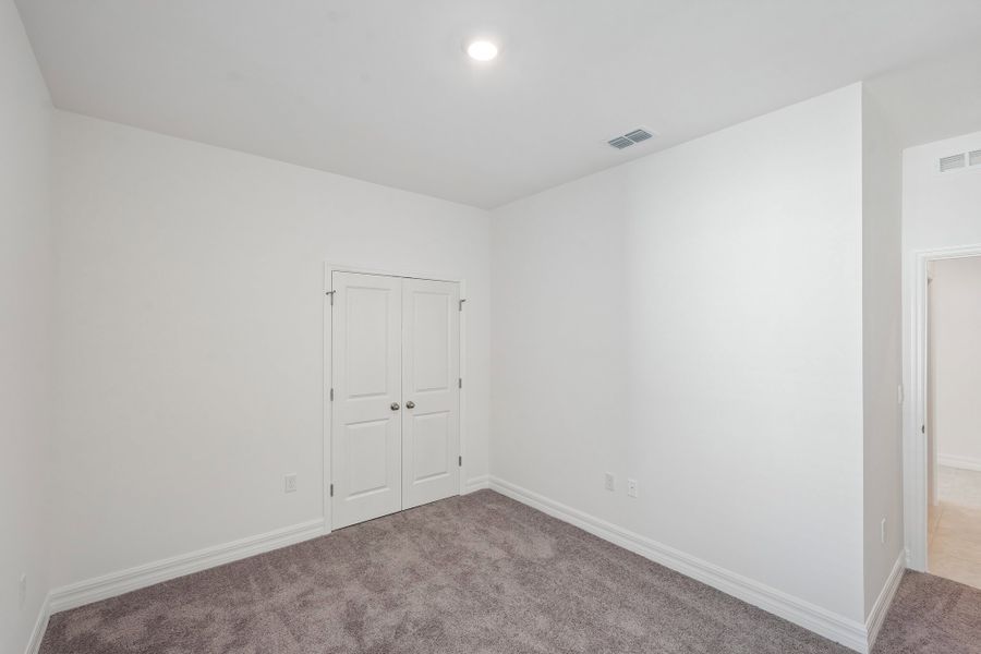 Spacious, unfurnished interior of a new home in Heritage Station, Punta Gorda (Image 53).
