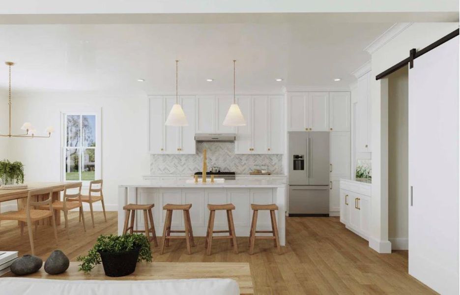 Culinary creativity flows in this sun-drenched kitchen, boasting a spacious island and gleaming stainless steel appliances.