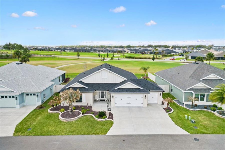 Front exterior of a new home in , The Villages, FL, highlighting curb appeal (Image 24).