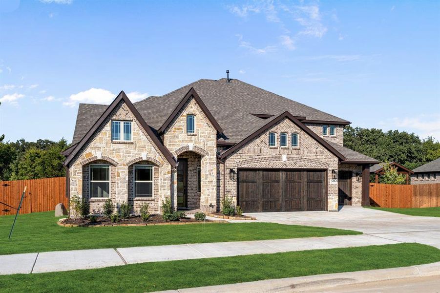 Front exterior of a new home in Triple Diamond Ranch, Mansfield, TX, highlighting curb appeal (Image 1). Front exterior of a new home in Triple Diamond Ranch, Mansfield, TX, highlighting curb appeal (Image 1).