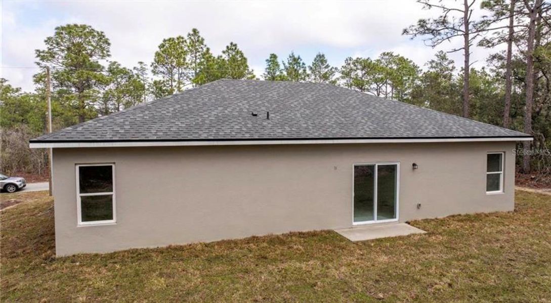 Exterior details and patio area of a home in , Citrus Springs (Image 3).