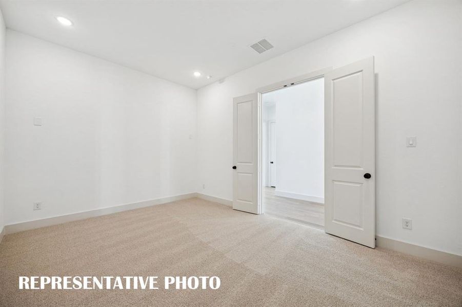 The spacious media room is the perfect place to host family movie night or big game day parties!  REPRESENTATIVE PHOTO