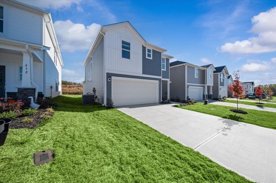 Front exterior of a new home in Village at White Pine, Pendleton, SC, highlighting curb appeal (Image 2). Front exterior of a new home in Village at White Pine, Pendleton, SC, highlighting curb appeal (Image 2).