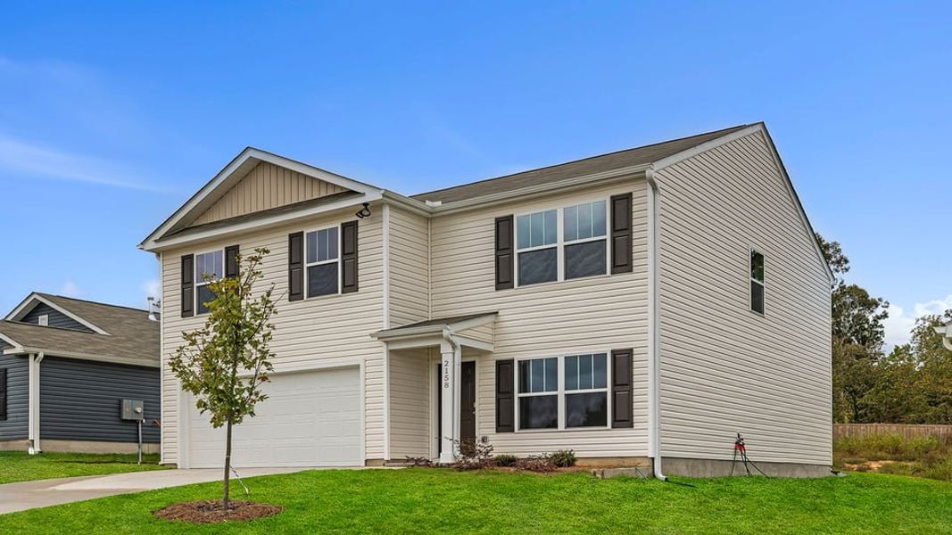 Front exterior of a new home in Harrier Point, Woodruff, SC, highlighting curb appeal (Image 2). Front exterior of a new home in Harrier Point, Woodruff, SC, highlighting curb appeal (Image 2).
