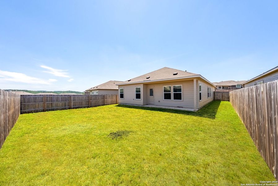Front exterior of a new home in , Bulverde, TX, highlighting curb appeal (Image 27).
