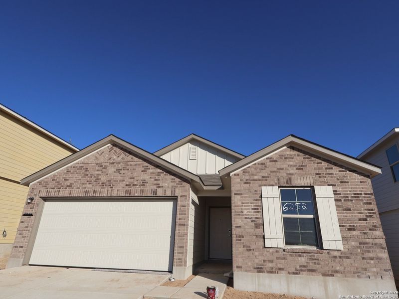 Front exterior of a new home in Mesquite Ridge, San Antonio, TX, highlighting curb appeal (Image 15).