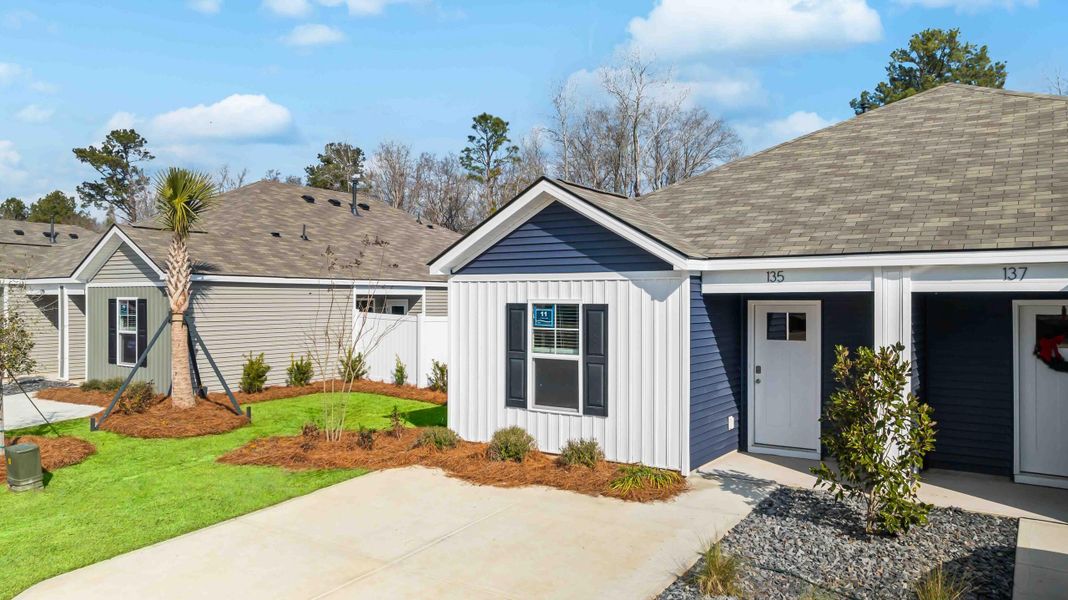 Front exterior of a new home in The Timbers, Harleyville, SC, highlighting curb appeal (Image 1). Front exterior of a new home in The Timbers, Harleyville, SC, highlighting curb appeal (Image 1).
