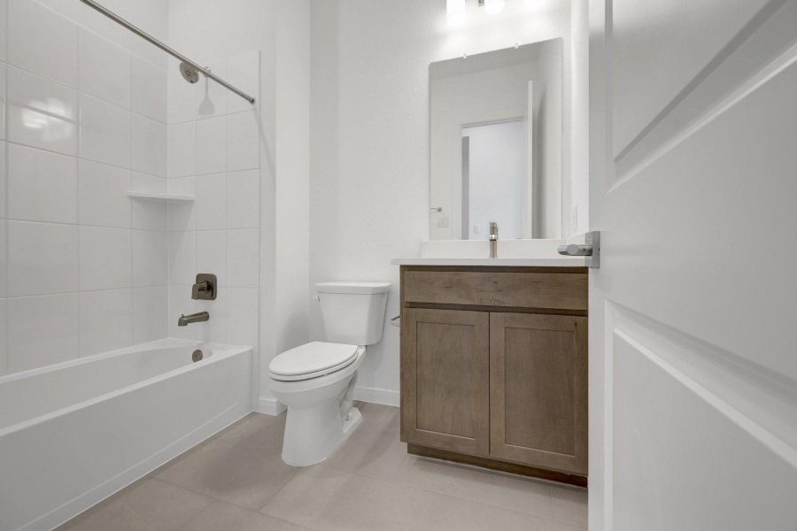 Furnished interior view inside a new home in Meridiana - Terrace Collection, Manvel (Image 3).