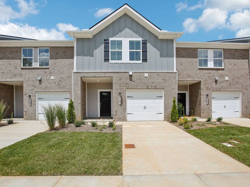 Front exterior of a new home in Cedarcrest Townhomes, Fairview, TN, highlighting curb appeal (Image 1).