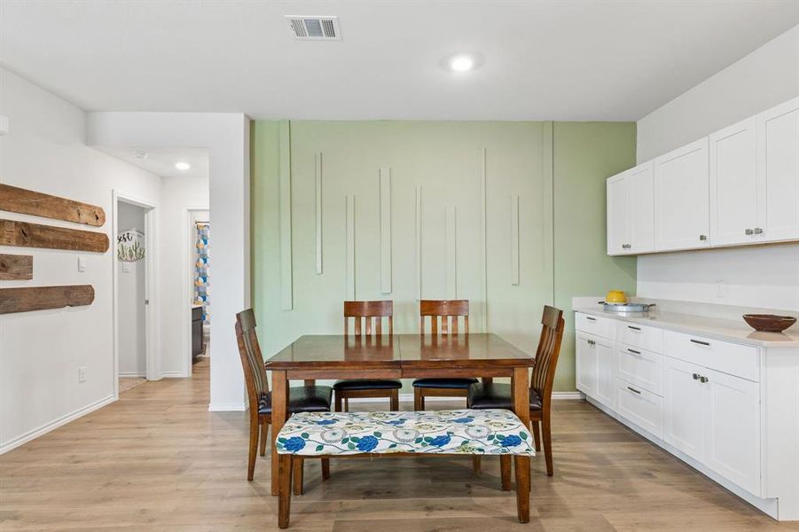Dining area featuring light wood-style flooring and recessed lighting Dining area featuring light wood-style flooring and recessed lighting