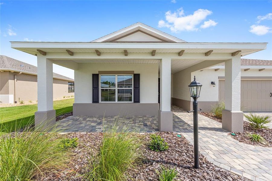 Front exterior of a new home in On Top of the World Communities, Ocala, FL, highlighting curb appeal (Image 19). Front exterior of a new home in On Top of the World Communities, Ocala, FL, highlighting curb appeal (Image 19).