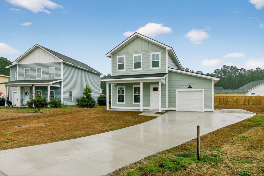 Front exterior of a new home in , Huger, SC, highlighting curb appeal (Image 2). Front exterior of a new home in , Huger, SC, highlighting curb appeal (Image 2).