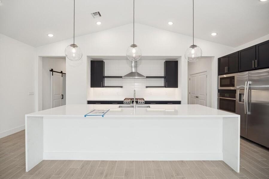 (Some or all of photography is of model or similar home and/or renderings and not necessarily indicative of available home). This home has white kitchen cabinets.